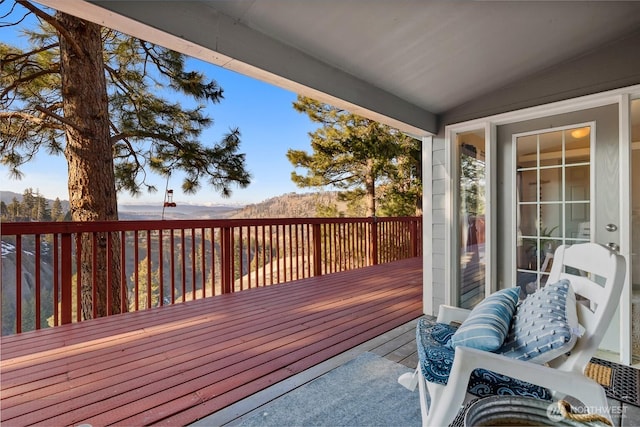 wooden deck featuring a mountain view