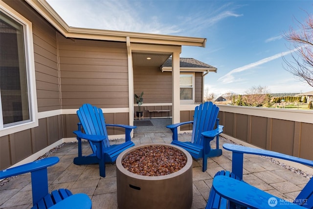 view of patio / terrace featuring an outdoor fire pit