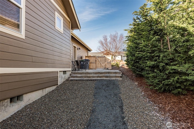 view of yard featuring fence and a patio area