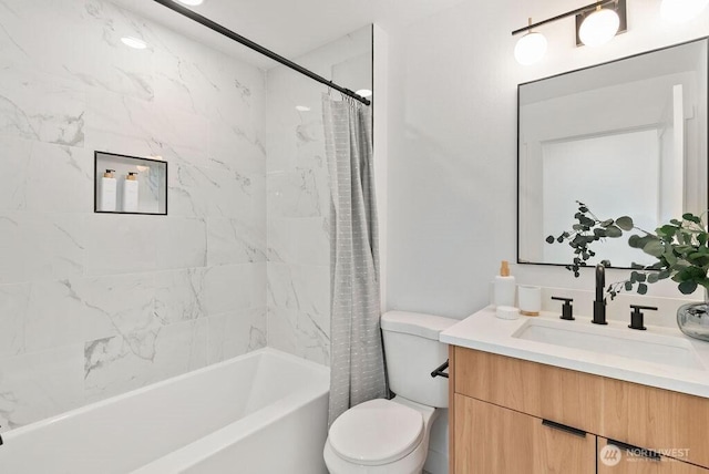 bathroom with toilet, shower / bath combo, and vanity