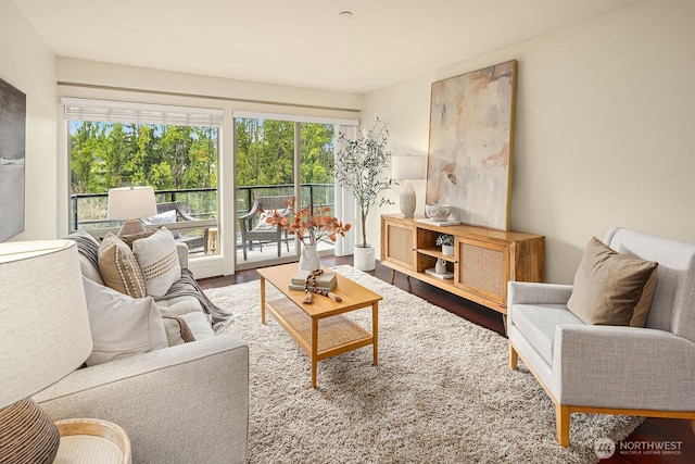 living area featuring a wealth of natural light and wood finished floors