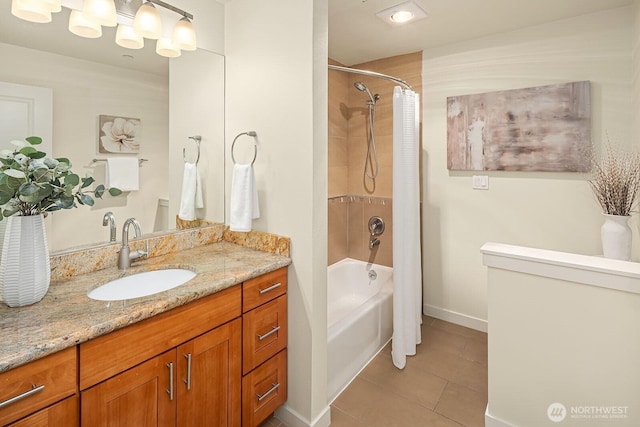 full bathroom featuring tile patterned floors, baseboards, shower / tub combo with curtain, and vanity