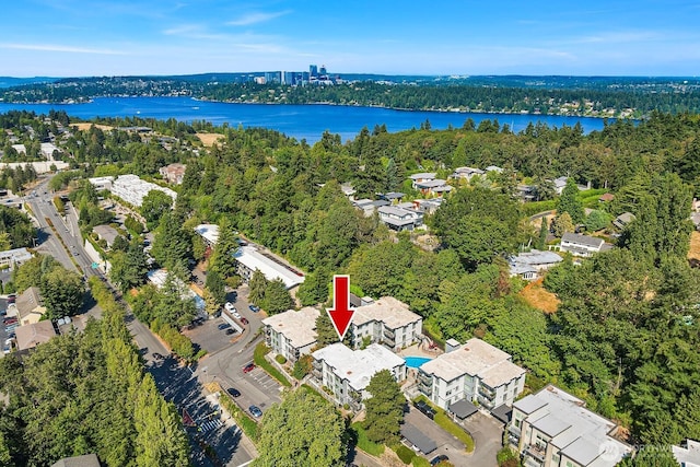 bird's eye view featuring a water view and a view of trees