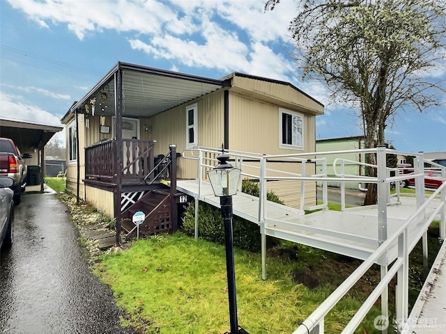 view of home's exterior with an attached carport