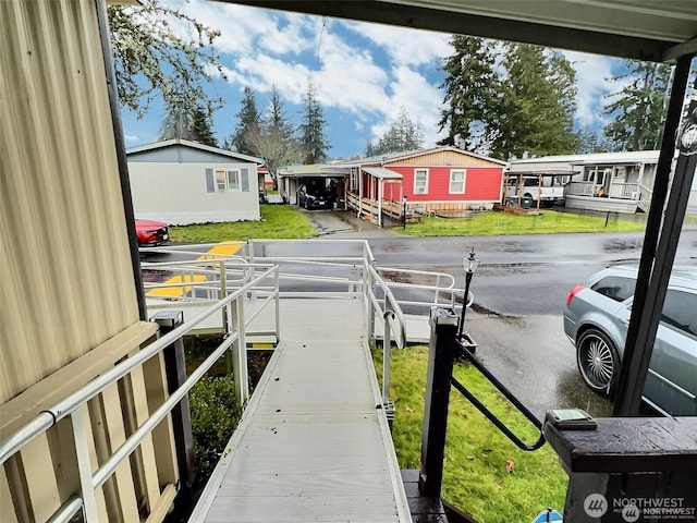 dock area featuring a yard and a residential view