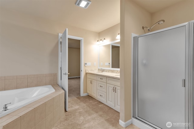 full bath featuring a garden tub, a stall shower, a sink, and visible vents