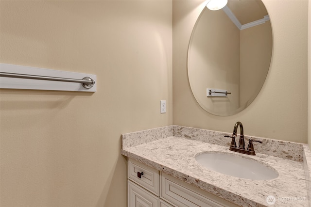 bathroom with vanity and crown molding