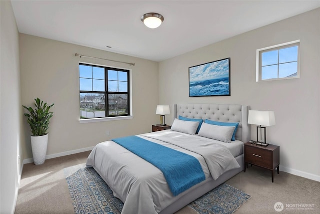 carpeted bedroom featuring visible vents and baseboards