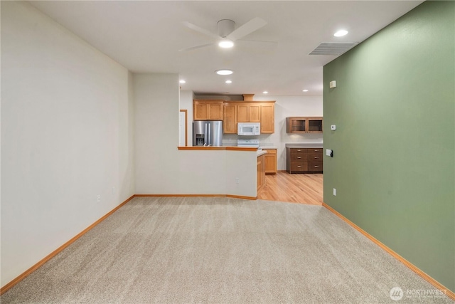 unfurnished living room with baseboards, recessed lighting, visible vents, and light colored carpet