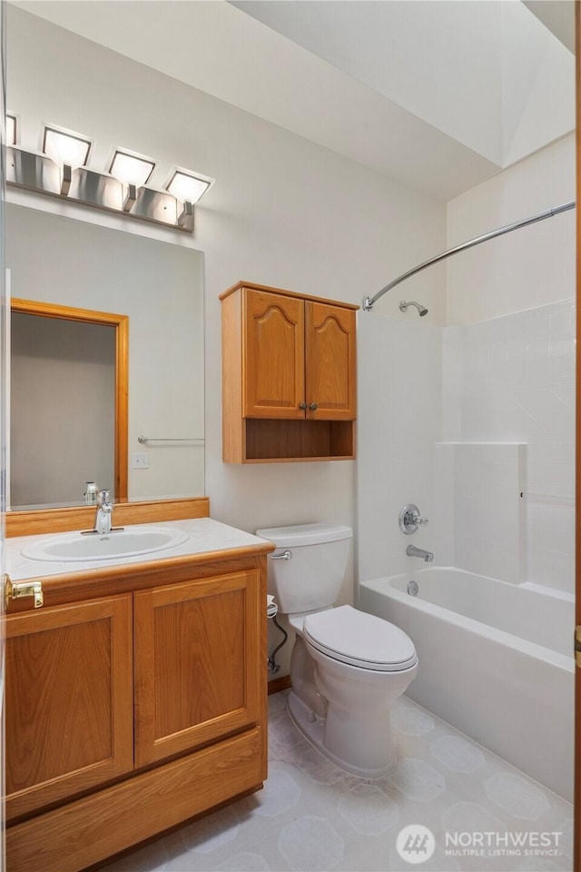 bathroom featuring shower / tub combination, vanity, and toilet