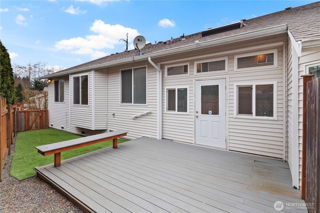 wooden deck featuring a yard and a fenced backyard