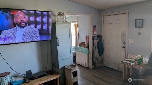 interior space featuring lofted ceiling and wood finished floors