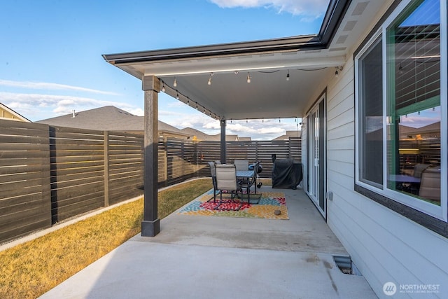 view of patio / terrace featuring a fenced backyard, visible vents, grilling area, and outdoor dining space