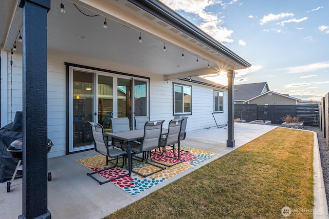 view of patio / terrace featuring fence