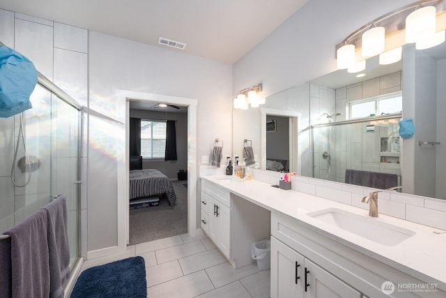 bathroom with a healthy amount of sunlight, ensuite bath, visible vents, and a shower stall