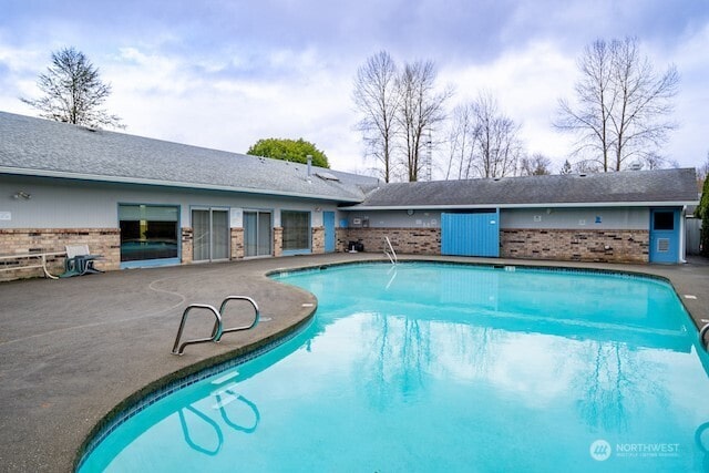 view of swimming pool featuring a fenced in pool and a patio