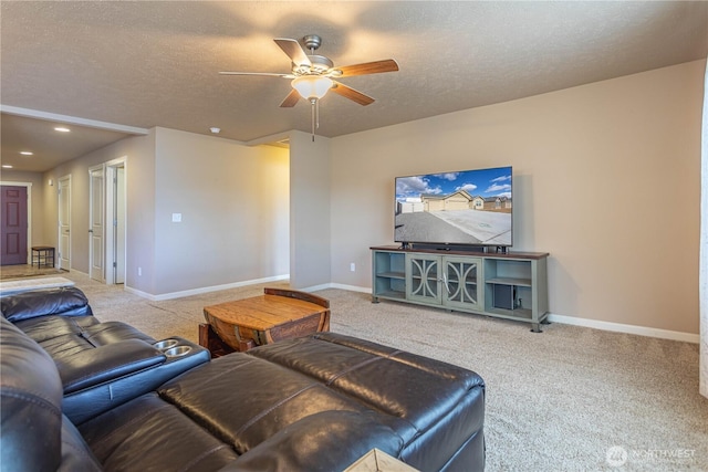 carpeted living room with ceiling fan, recessed lighting, baseboards, and a textured ceiling