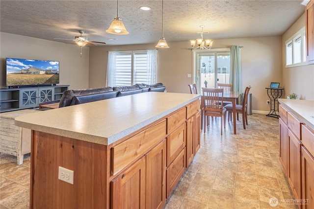 kitchen with plenty of natural light, light countertops, and open floor plan