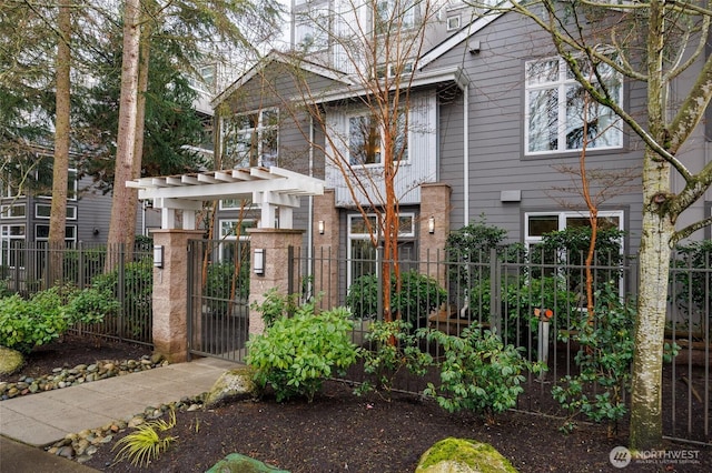 view of front facade with a gate and fence