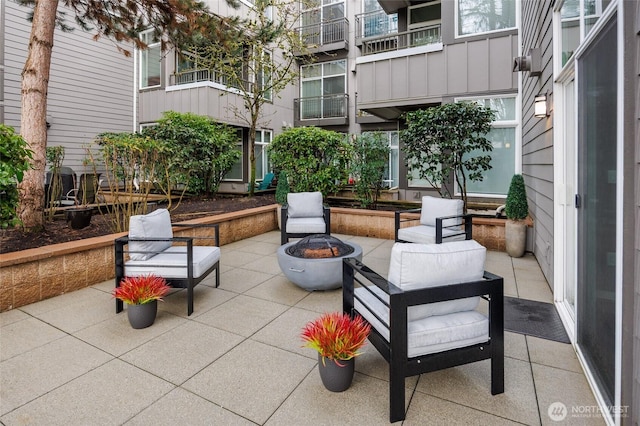 view of patio / terrace with a fire pit