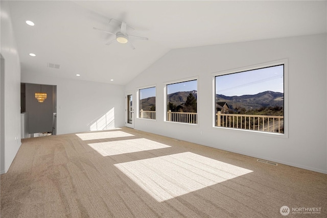 133 Long Dr, Chelan, WA 98816 - empty room with ceiling fan with notable chandelier, vaulted ceiling, carpet, and visible vents
