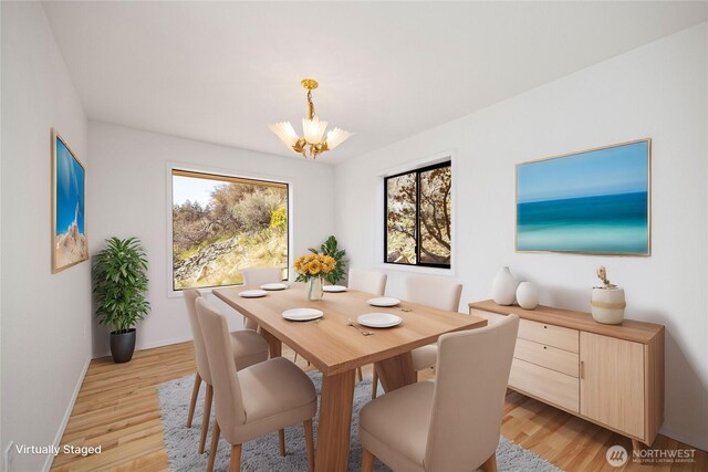 133 Long Dr, Chelan, WA 98816 - dining area with light wood finished floors, an inviting chandelier, and baseboards