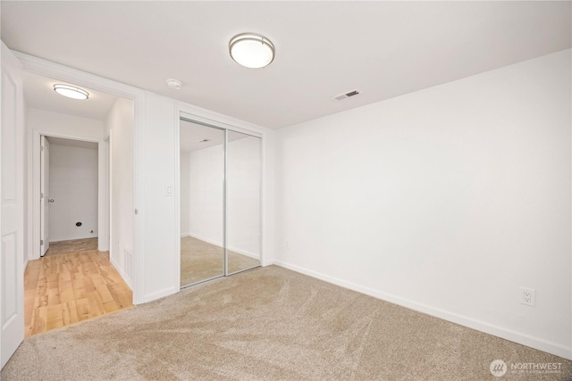 133 Long Dr, Chelan, WA 98816 - unfurnished bedroom with a closet, visible vents, baseboards, and carpet
