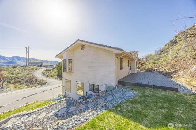 133 Long Dr, Chelan, WA 98816 - view of home's exterior with a yard and a deck with mountain view