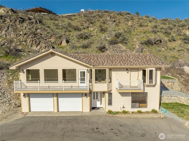 133 Long Dr, Chelan, WA 98816 - view of front of home with a garage, driveway, and a balcony