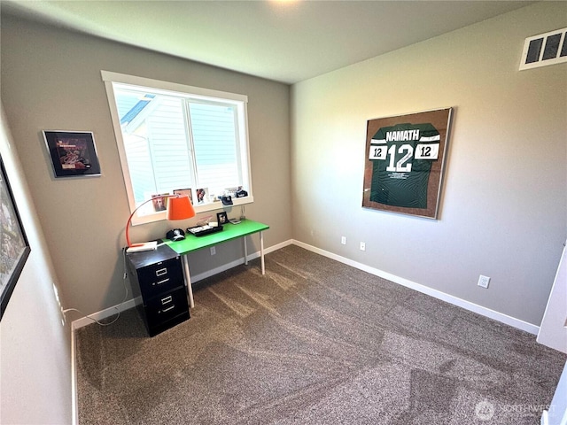 office with dark colored carpet, visible vents, and baseboards