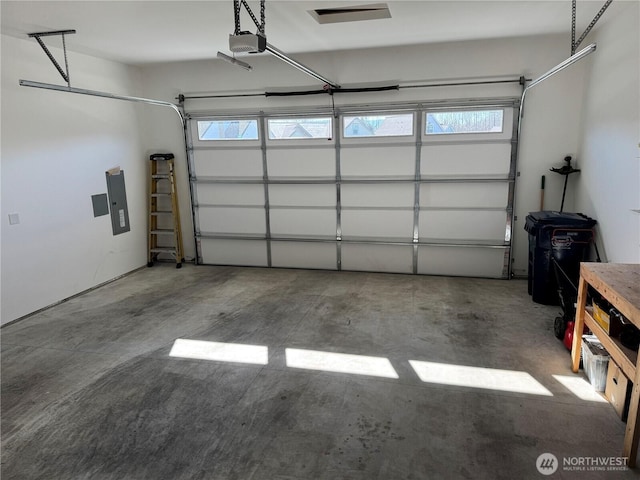 garage featuring a garage door opener