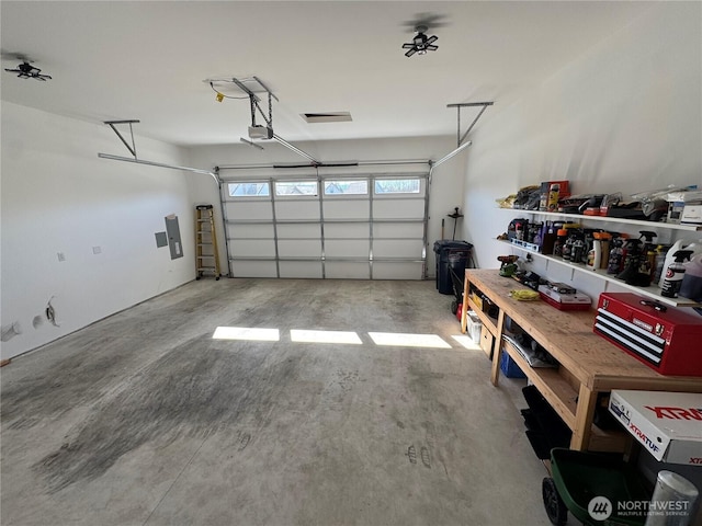 garage featuring a garage door opener and electric panel