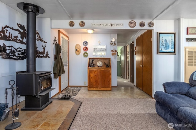 living room featuring a wood stove