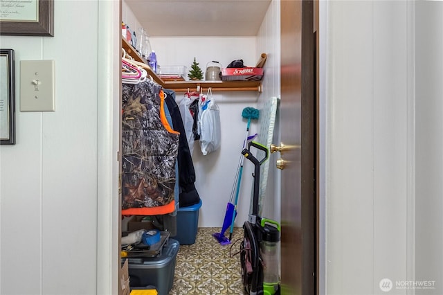 walk in closet with tile patterned floors