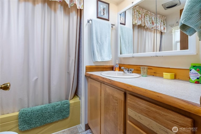 full bath featuring shower / bath combo and vanity