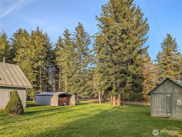 view of yard with an outbuilding and a shed