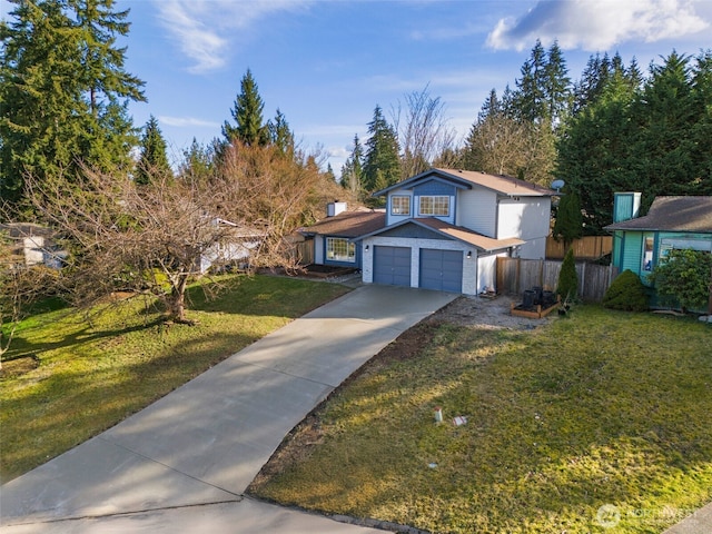 traditional-style house featuring a garage, concrete driveway, a front lawn, and fence