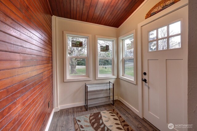 doorway to outside featuring wood ceiling, a healthy amount of sunlight, baseboards, and wood finished floors