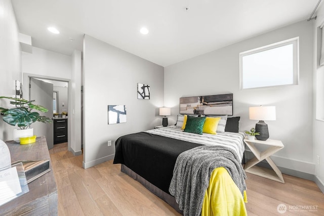 bedroom featuring recessed lighting, light wood-style flooring, and baseboards