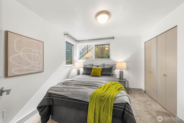 carpeted bedroom featuring a closet