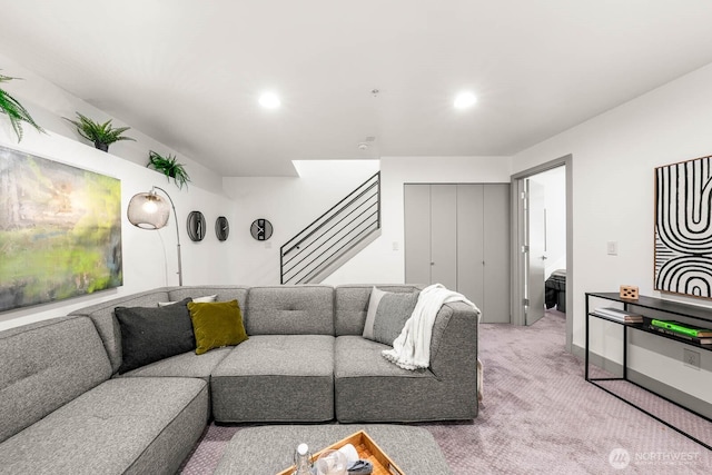 carpeted living room featuring stairway and recessed lighting