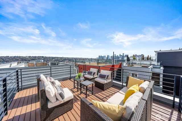 wooden terrace with a view of city and outdoor lounge area