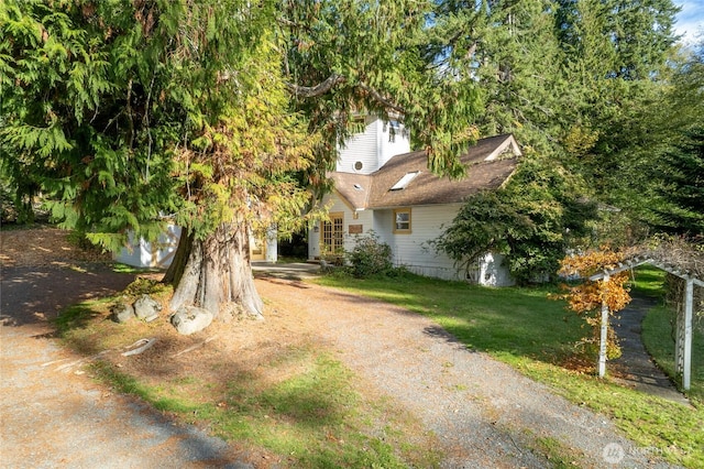 exterior space featuring a front yard and driveway