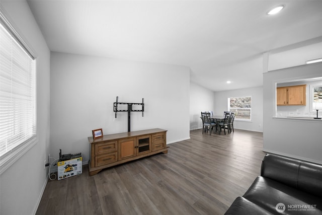 living area featuring vaulted ceiling, recessed lighting, dark wood finished floors, and baseboards