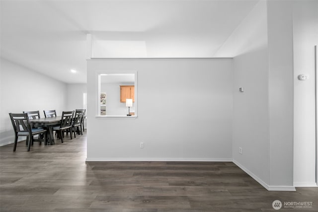 dining room with wood finished floors and baseboards