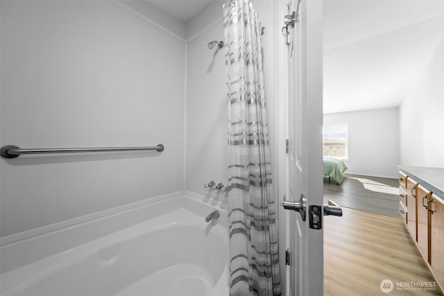 full bathroom with wood finished floors and vanity