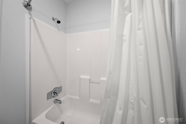 full bathroom with shower / tub combo with curtain