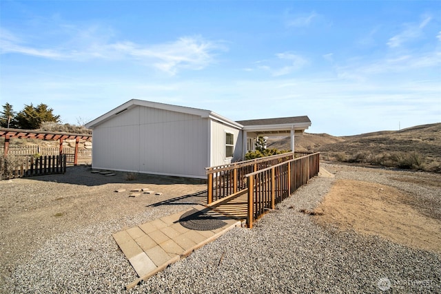 view of side of home with fence