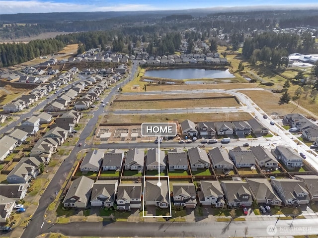 aerial view featuring a water view and a residential view