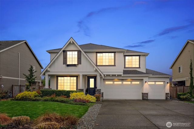 view of front of house featuring an attached garage, fence, concrete driveway, a front lawn, and board and batten siding